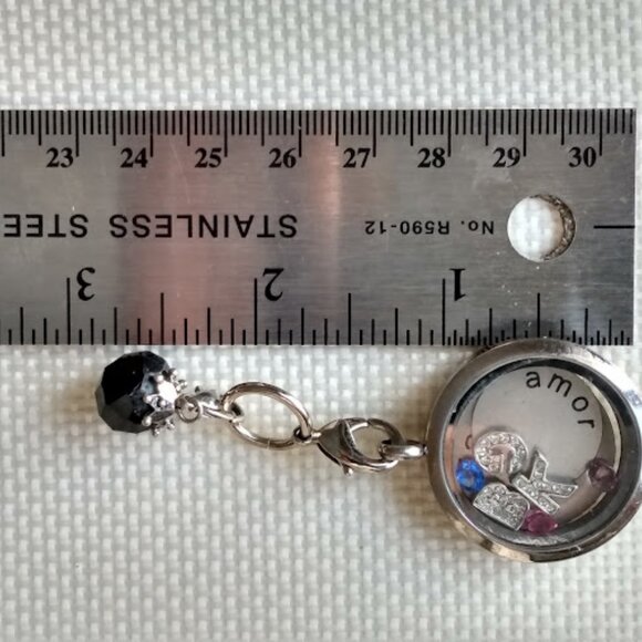 Silver Tone Locket with Black Charm and Trinkets Inside - Picture 5 of 6